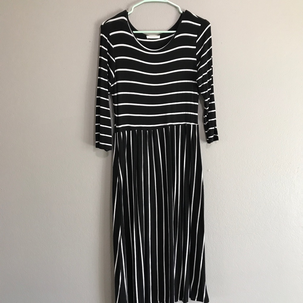Black and white stripe midi dress with pockets.